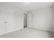 A neutral bedroom with carpet, closet, and door leading to other rooms at 614 Lightwood Dr., Conway, SC 29526