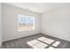 Bright bedroom with plush carpeting and a large window offering plenty of natural light at 618 Lightwood Dr., Conway, SC 29526