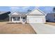 Well maintained one story home with neutral colors, a two car garage and green lawn at 618 Lightwood Dr., Conway, SC 29526