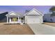 Charming single-story home with a two-car garage and well-maintained landscaping at 618 Lightwood Dr., Conway, SC 29526