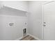 Functional laundry room with utility sink, washer/dryer hookups, and white door at 618 Lightwood Dr., Conway, SC 29526