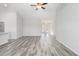 Spacious living room with wood-look floors, open layout, and abundant natural light at 618 Lightwood Dr., Conway, SC 29526