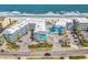 Aerial view showing the beachside condo buildings and its proximity to the beach and ocean at 720 N Waccamaw Dr. # 202, Garden City Beach, SC 29576