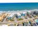 Breathtaking aerial view captures the property's beachfront location, pool, and ocean views at 720 N Waccamaw Dr. # 202, Garden City Beach, SC 29576