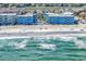 An aerial view of apartments that front the beach and have community pool access at 720 N Waccamaw Dr. # 202, Garden City Beach, SC 29576