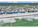 An aerial view of a neighborhood located on the coast and has a beautiful beach at 720 N Waccamaw Dr. # 202, Garden City Beach, SC 29576