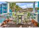 A charming balcony setup with cozy seating, perfect for relaxing and enjoying the surrounding scenery at 720 N Waccamaw Dr. # 202, Garden City Beach, SC 29576