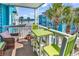 Balcony seating area with pleasant ocean views, perfect for enjoying the beach lifestyle at 720 N Waccamaw Dr. # 202, Garden City Beach, SC 29576