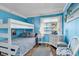 Bright bedroom with a bunk bed and coastal decor, creating a cozy and inviting space at 720 N Waccamaw Dr. # 202, Garden City Beach, SC 29576