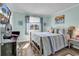 Bright bedroom with a comfortable bed, beach themed decor, and a pleasant view at 720 N Waccamaw Dr. # 202, Garden City Beach, SC 29576