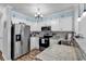 This kitchen features granite countertops, stainless steel appliances, and beachy accents for a coastal retreat at 720 N Waccamaw Dr. # 202, Garden City Beach, SC 29576