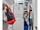 Efficient laundry area with stacked washer and dryer, providing in-unit convenience at 720 N Waccamaw Dr. # 202, Garden City Beach, SC 29576