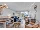 Relaxing living room featuring casual seating, beach-themed decor, and access to an outdoor balcony with ocean views at 720 N Waccamaw Dr. # 202, Garden City Beach, SC 29576