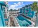 A view of the pool at the beach property with nice blue buildings and white decks at 720 N Waccamaw Dr. # 202, Garden City Beach, SC 29576
