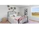Cozy bedroom with a black metal bed frame, and a view from the window at 738 Chazen Way, Longs, SC 29568