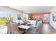 Open-concept dining and living area with stylish furnishings and bright natural light at 738 Chazen Way, Longs, SC 29568
