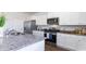 Kitchen featuring white cabinets, stainless steel appliances, granite countertops, and modern fixtures at 738 Chazen Way, Longs, SC 29568
