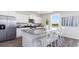 Open kitchen with a large island, granite countertops, stainless steel appliances, and white cabinetry at 738 Chazen Way, Longs, SC 29568