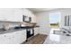 Bright kitchen with white cabinets, stainless steel appliances, granite countertops, and ample counter space at 738 Chazen Way, Longs, SC 29568