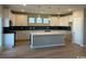 Modern kitchen featuring white cabinets, a large island, sleek countertops, and stainless steel appliances at 753 Wailea Circle, Little River, SC 29566