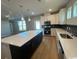 Contemporary kitchen boasting a central island, pendant lighting, and stainless steel appliances at 753 Wailea Circle, Little River, SC 29566