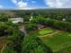 Scenic aerial view of the golf course and green spaces surrounded by mature trees at 75-4 Weehawka Way # 4, Pawleys Island, SC 29585
