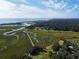 Spectacular aerial view of the golf course, river, and beach, highlighting the community's natural beauty at 75-4 Weehawka Way # 4, Pawleys Island, SC 29585