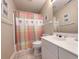 Cozy bathroom with a vanity, sink, toilet, and shower-tub combo, with framed photos on the walls at 75-4 Weehawka Way # 4, Pawleys Island, SC 29585