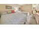 Comfortable bedroom with two twin beds, neutral tones, and access to a convenient wet bar at 75-4 Weehawka Way # 4, Pawleys Island, SC 29585