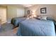 Comfortable bedroom with two beds, neutral decor, and ample closet space at 75-4 Weehawka Way # 4, Pawleys Island, SC 29585