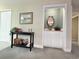 An inviting entryway with a console table and a glimpse of the convenient wet bar area at 75-4 Weehawka Way # 4, Pawleys Island, SC 29585