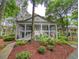 Two-story condo features double balconies and is surrounded by mature trees and manicured landscaping at 75-4 Weehawka Way # 4, Pawleys Island, SC 29585