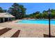 Outdoor swimming pool with lounge chairs and umbrellas, perfect for relaxing in the sun at 75-4 Weehawka Way # 4, Pawleys Island, SC 29585