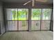 Screened-in porch with a view of green spaces at 75-4 Weehawka Way # 4, Pawleys Island, SC 29585