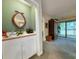A well-appointed wet bar with a sink, wine rack, and a unique round mirror, perfect for entertaining guests at 75-4 Weehawka Way # 4, Pawleys Island, SC 29585