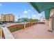 Spacious outdoor balcony showing lovely wrought iron detail and surrounding buildings under a sunny sky at 807 N Waccamaw Dr., Murrells Inlet, SC 29576