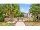 Inviting community pool area with brick fence, lush palm trees, and secure gate access at 807 N Waccamaw Dr., Murrells Inlet, SC 29576