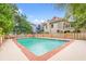 Large community pool surrounded by brick fence and greenery, perfect for relaxation at 807 N Waccamaw Dr., Murrells Inlet, SC 29576