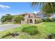 Charming mediterranean-style home featuring lush landscaping and a beautiful brick facade at 807 N Waccamaw Dr., Murrells Inlet, SC 29576