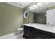 Well-lit bathroom features a double sink vanity, a toilet, and decorative mirror at 8207 Timber Ridge Rd., Conway, SC 29526