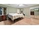 Bright bedroom features wood floors, a ceiling fan, and a large mirrored closet at 8207 Timber Ridge Rd., Conway, SC 29526