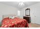 Cozy bedroom features natural light, ceiling fan, and neutral decor with hardwood style floor at 8207 Timber Ridge Rd., Conway, SC 29526