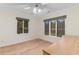 Bedroom features ample natural light from large windows, wood floors and ceiling fan at 8207 Timber Ridge Rd., Conway, SC 29526