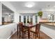 Bright eat-in dining area with wood floors, a bay window, and views to the outside at 8207 Timber Ridge Rd., Conway, SC 29526