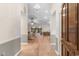 The beautiful entry of this home showcases its natural wood floors and open-concept living spaces at 8207 Timber Ridge Rd., Conway, SC 29526