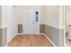 Bright entryway features hardwood floors, a closet, and a lovely front door with stained glass at 8207 Timber Ridge Rd., Conway, SC 29526