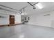 Spacious garage featuring sealed concrete floors, brick accents, and ample storage at 8207 Timber Ridge Rd., Conway, SC 29526