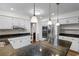 Bright eat-in kitchen features stainless appliances, granite counters, island, and abundant cabinet space at 8207 Timber Ridge Rd., Conway, SC 29526