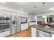 Bright open-concept kitchen with stainless steel appliances, granite countertops, and breakfast bar seating at 8207 Timber Ridge Rd., Conway, SC 29526