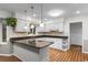 This kitchen features a breakfast bar, white cabinets, granite countertops and stainless steel appliances at 8207 Timber Ridge Rd., Conway, SC 29526